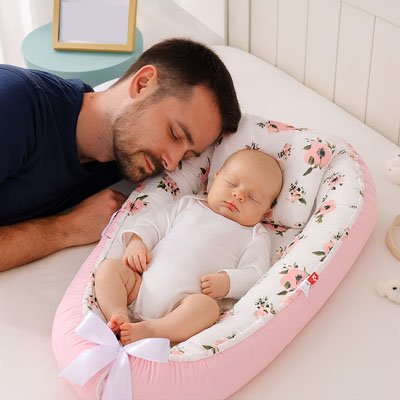 Reducteur de lit rose 