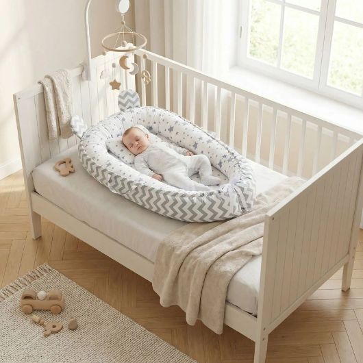 reducteur de lit gris pour des nuits apaisees